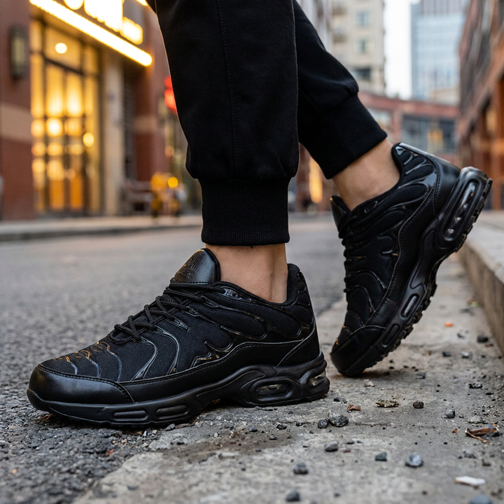 Men's black anti-slip work shoes worn on a city street