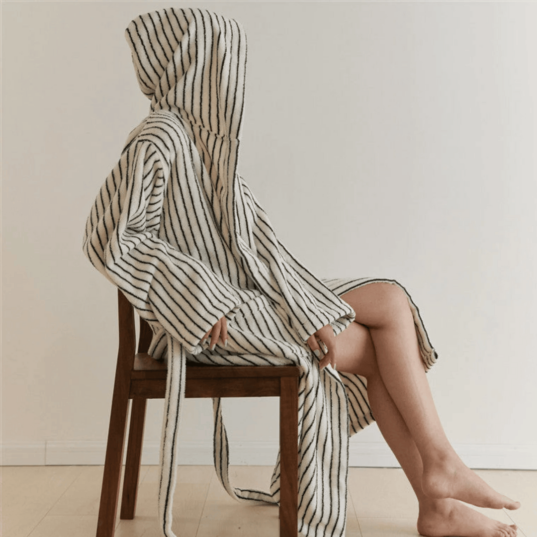 Black & White Hooded Jacquard Cotton Robe seated lifestyle