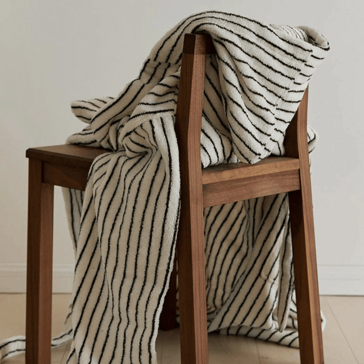 Black & White Hooded Jacquard Cotton Robe draped on chair