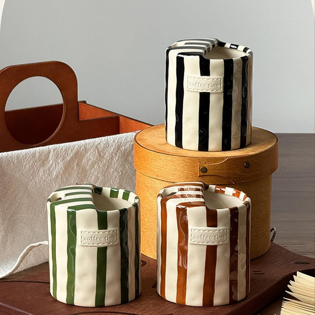 Black, Green, and Brown Retro Striped Ceramic Mugs styled with wooden crate