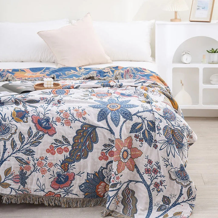 Jacquard Wildflower Cotton Throw spread across a made bed