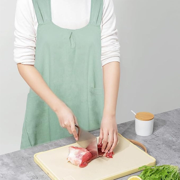Mint Green Korean-Style Pinafore Apron worn while cooking