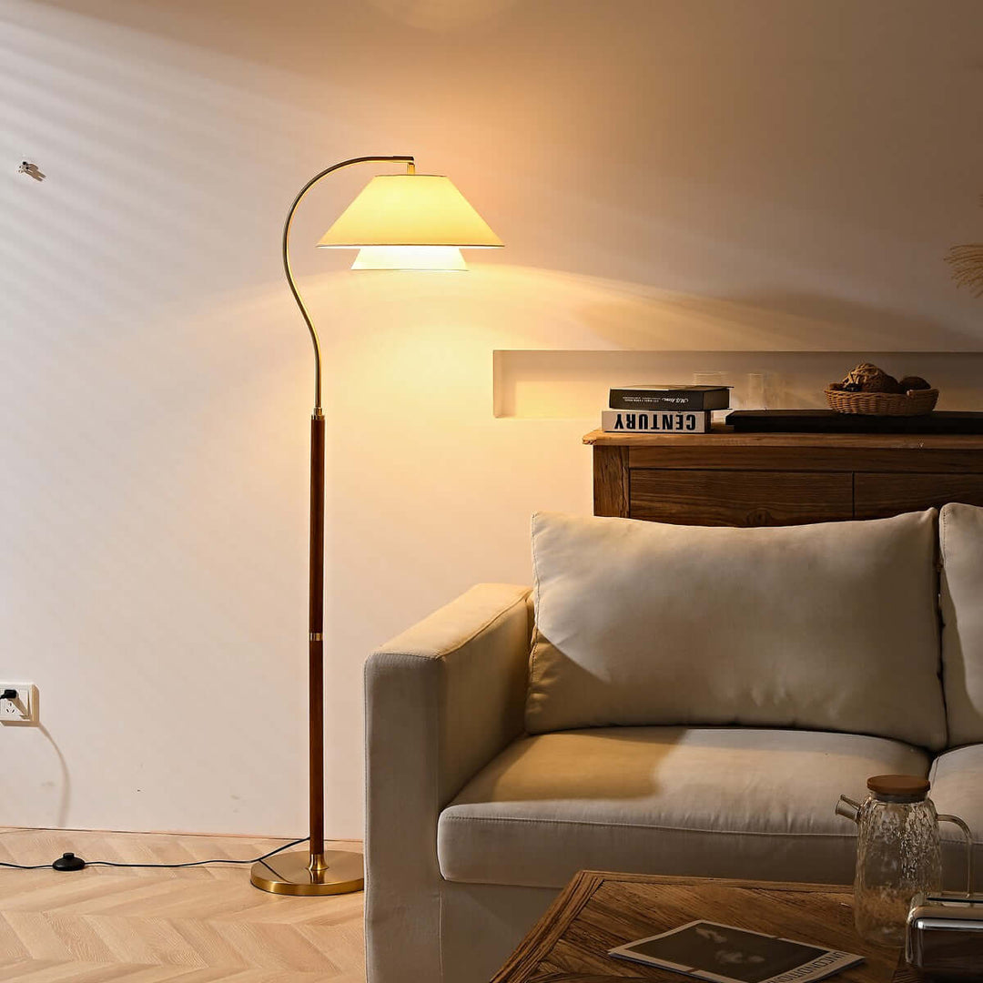 Walnut Layered Fabric Shade Arc Lamp beside sofa