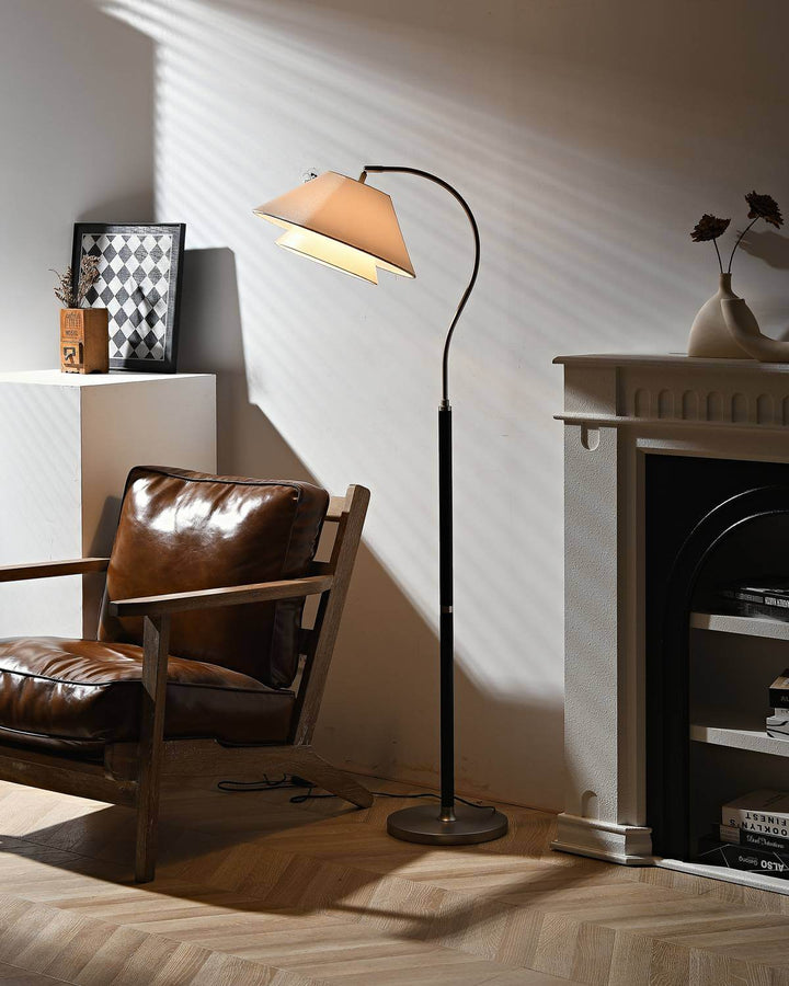 Walnut Layered Fabric Shade Arc Lamp beside leather chair
