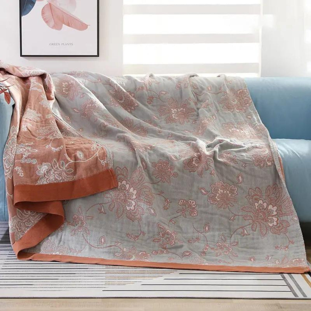 Red Layered Gauze Floral Cotton Throw on a sofa