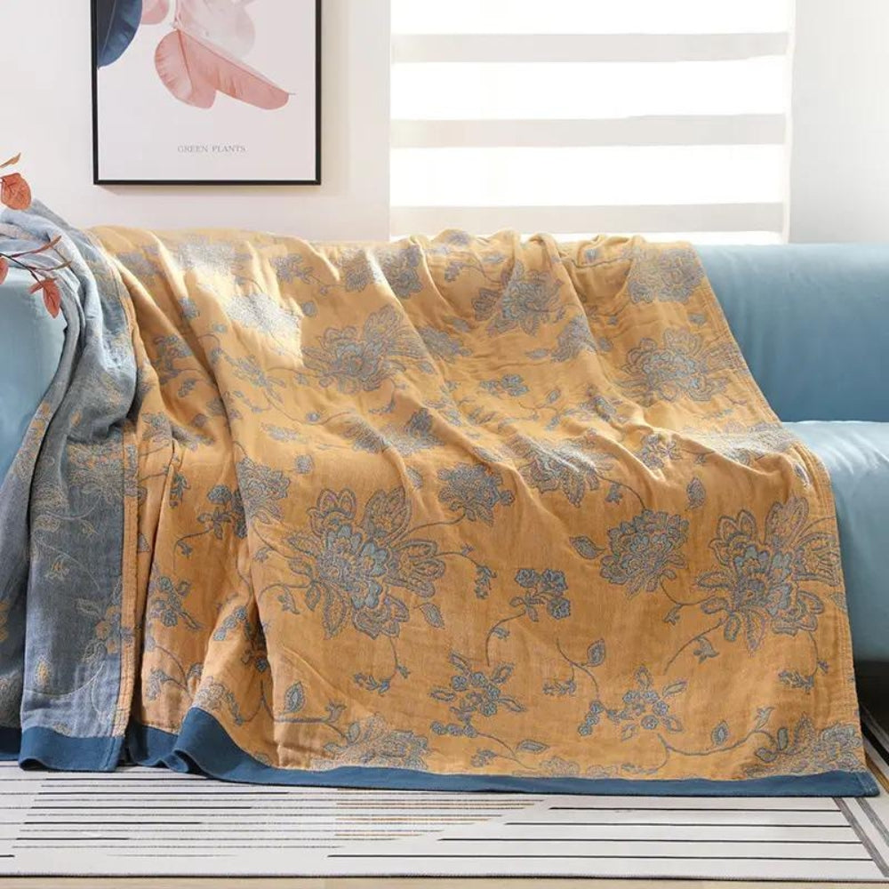 Yellow Layered Gauze Floral Cotton Throw on a sofa