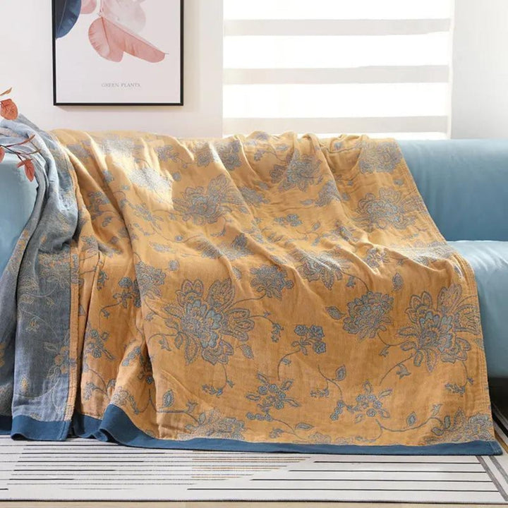 Yellow Layered Gauze Floral Cotton Throw on a sofa