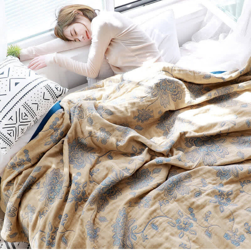 Yellow Layered Gauze Floral Cotton Throw used on a bed
