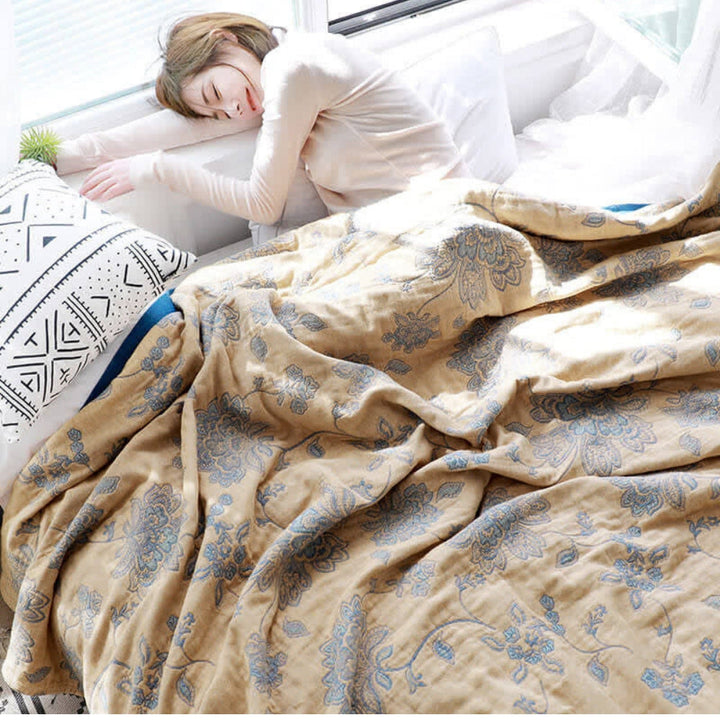 Yellow Layered Gauze Floral Cotton Throw used on a bed