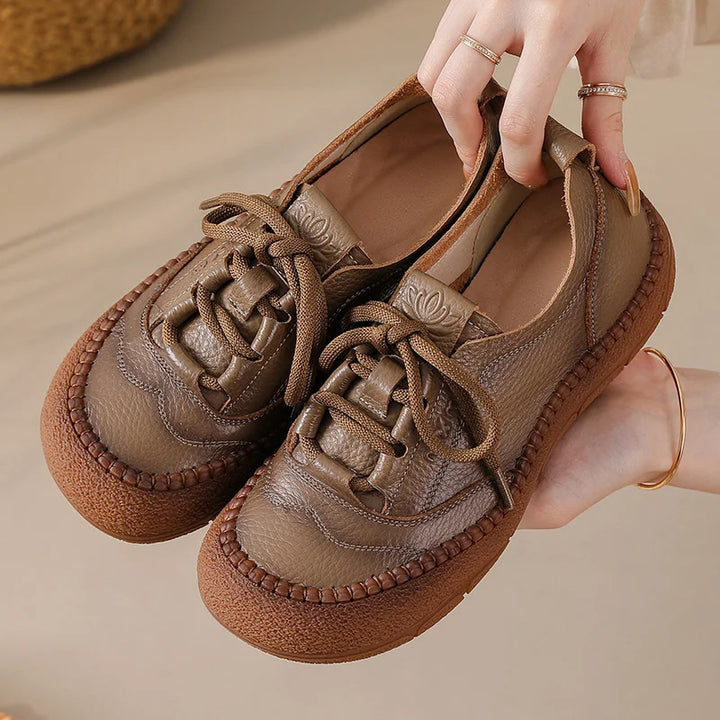 Light Brown Leather Platform Sneakers held in hand