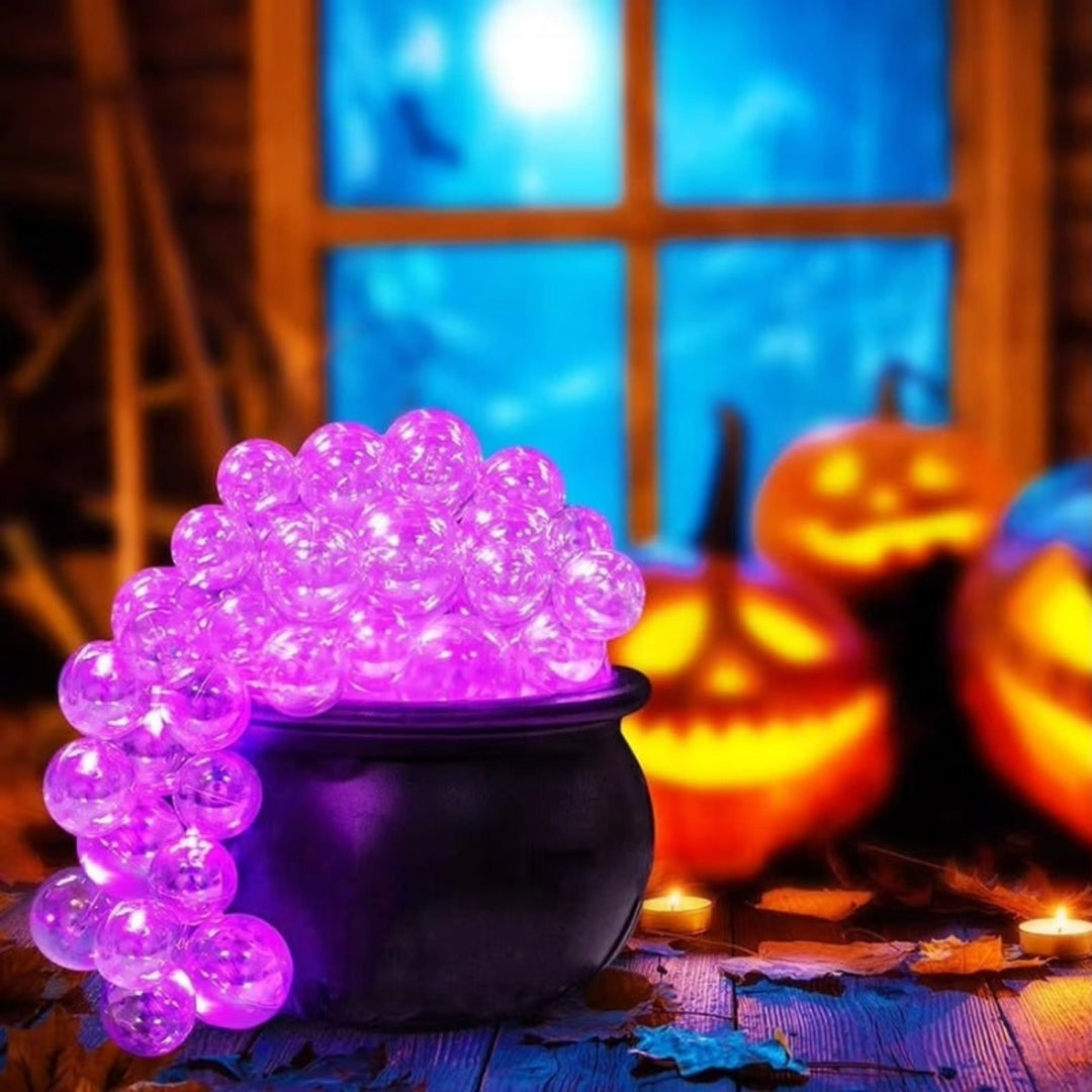 LED Glowing Orb Cauldron Decoration with jack-o-lanterns lifestyle