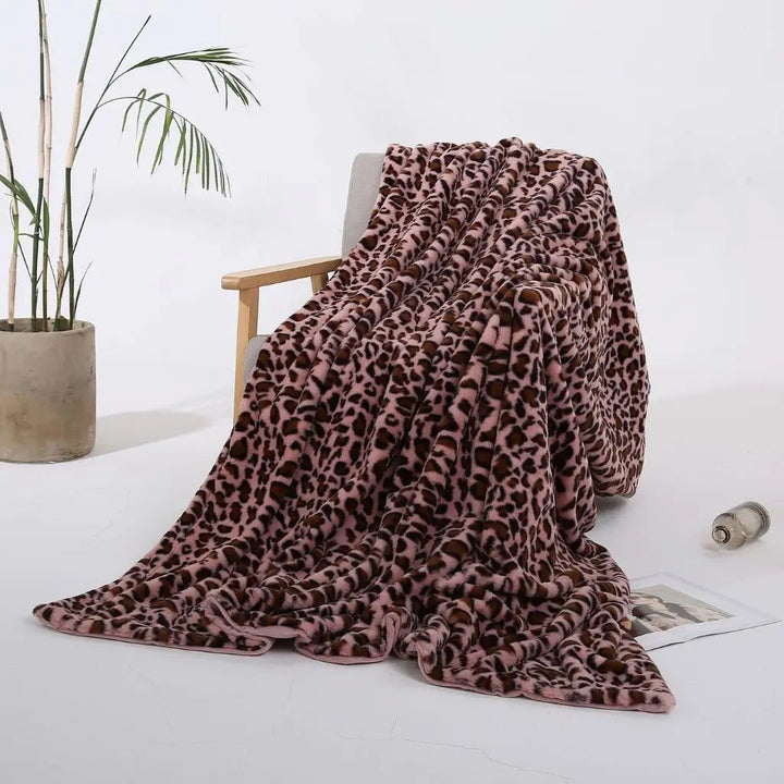 Leopard Print Velvet Throw Blanket on a bed