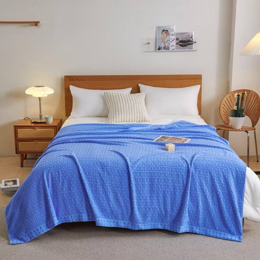 Blue Lightweight Cotton Waffle Bed Blanket on bed front view