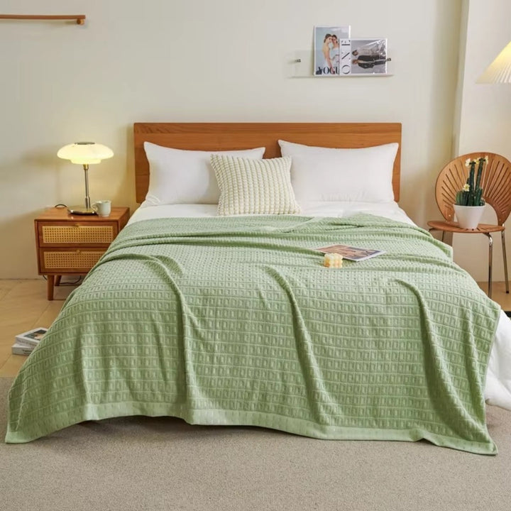 Sage Green Lightweight Cotton Waffle Bed Blanket on bed front view