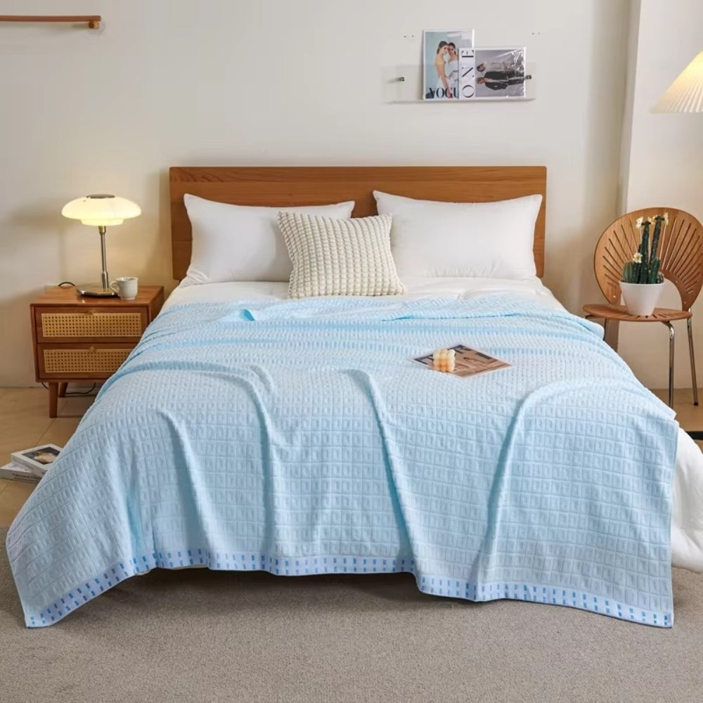 Light Blue Lightweight Cotton Waffle Bed Blanket on bed front view