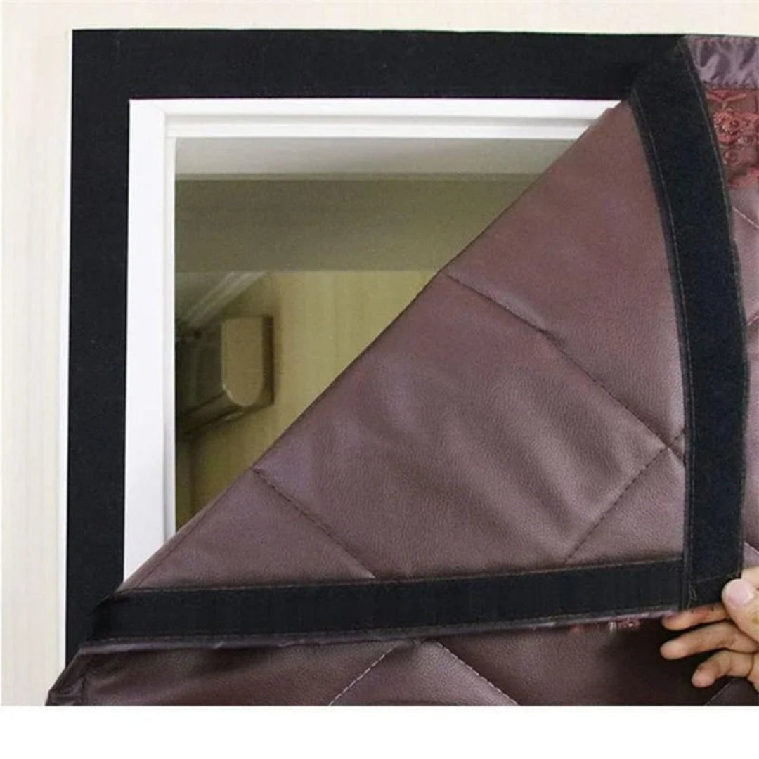 Brown quilted magnetic door curtain hung in a doorway