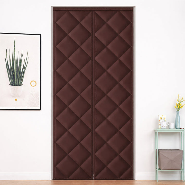 Quilted magnetic door curtain covering a closed door