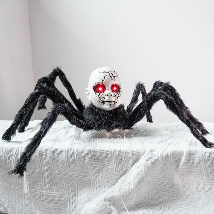 Animatronic spider prop displayed in a dark Halloween haunted house setting