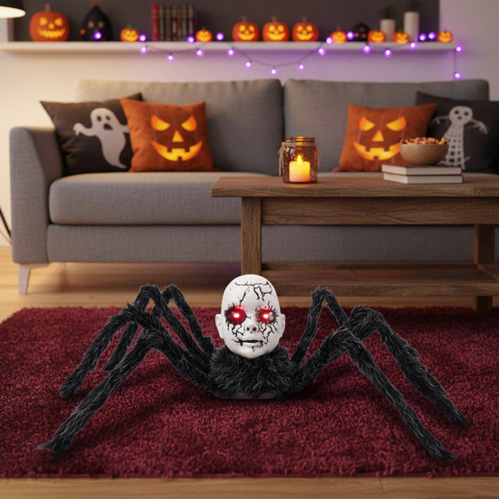 Animatronic spider prop doll-face detail with glowing eyes