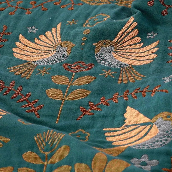 Nordic Bird Jacquard Cotton Throw golden bird motif detail