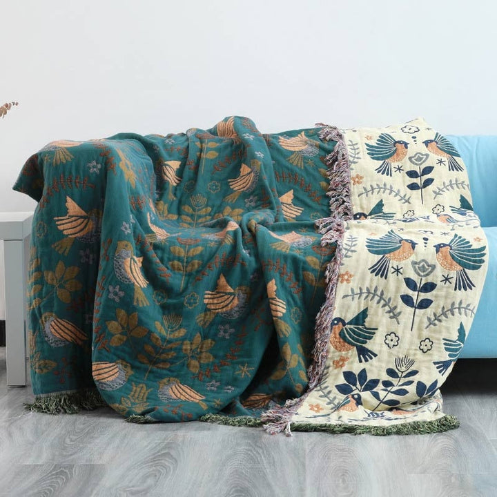 Nordic Bird Jacquard Cotton Throw showing both reversible faces