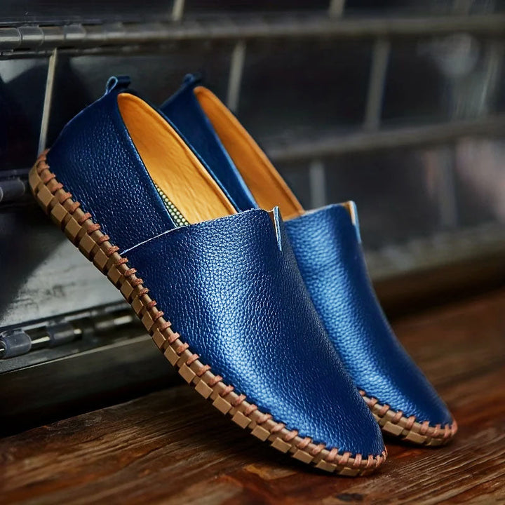 Navy Blue Pebbled Leather Loafers pair on display stand