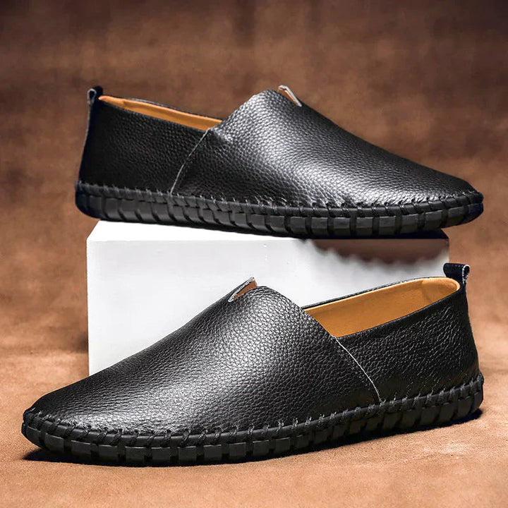 Classic Black Pebbled Leather Loafers pair on display stand