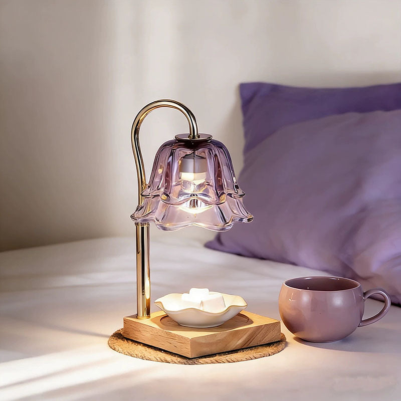 Purple Glass Wax Warmer Lamp warming wax melts on nightstand
