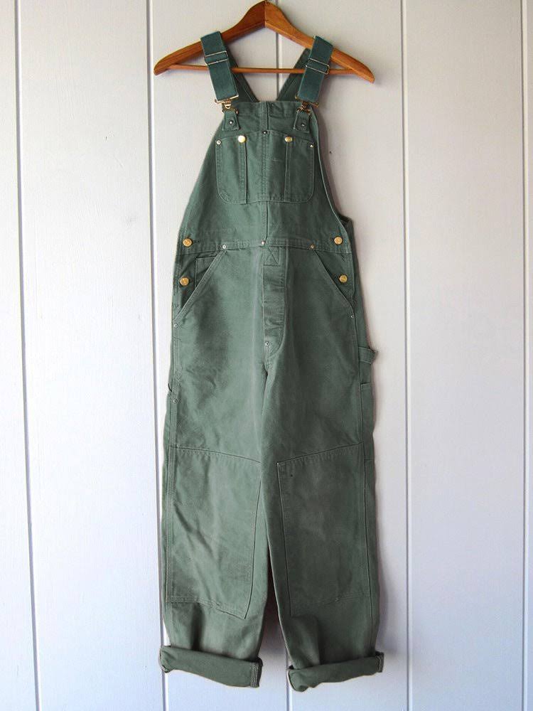 Green Retro Utility Overalls front view on hanger