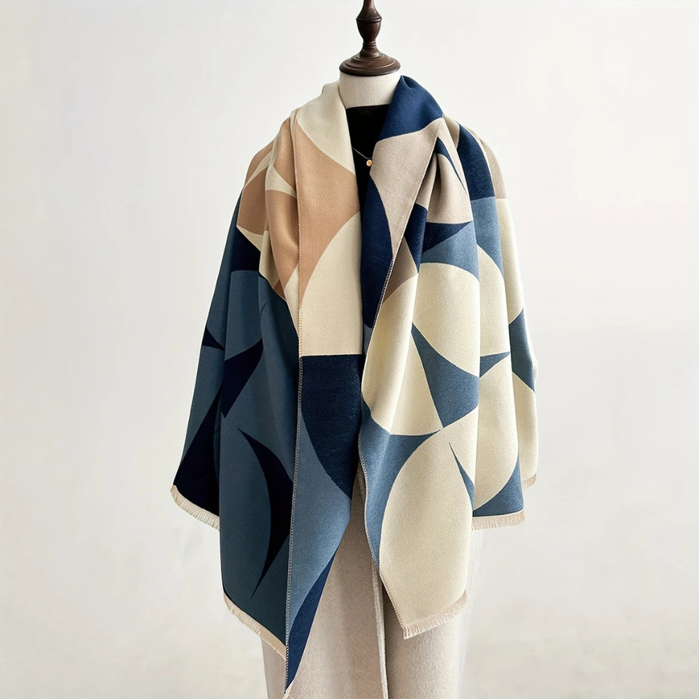 Blue and cream Reversible Geometric Poncho Blanket Scarf draped on mannequin