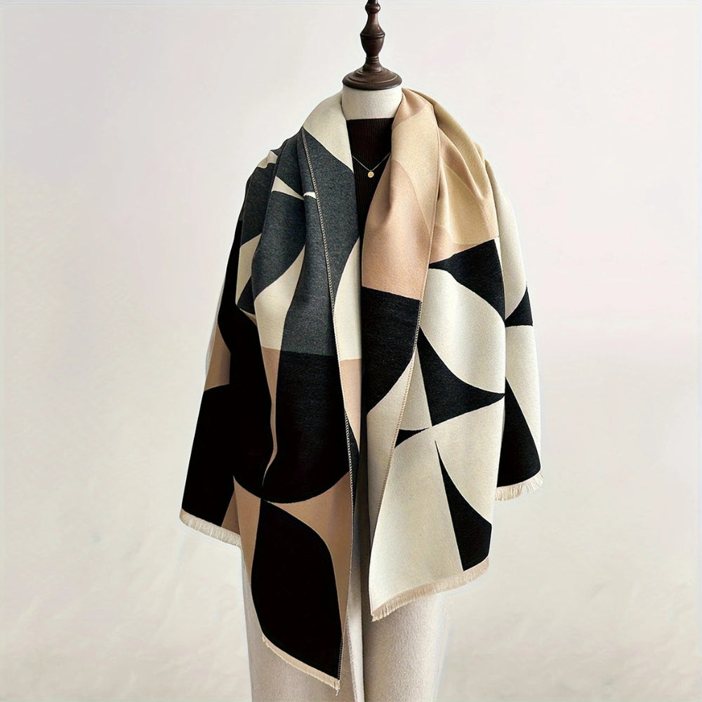 Charcoal and beige Reversible Geometric Poncho Scarf draped on mannequin