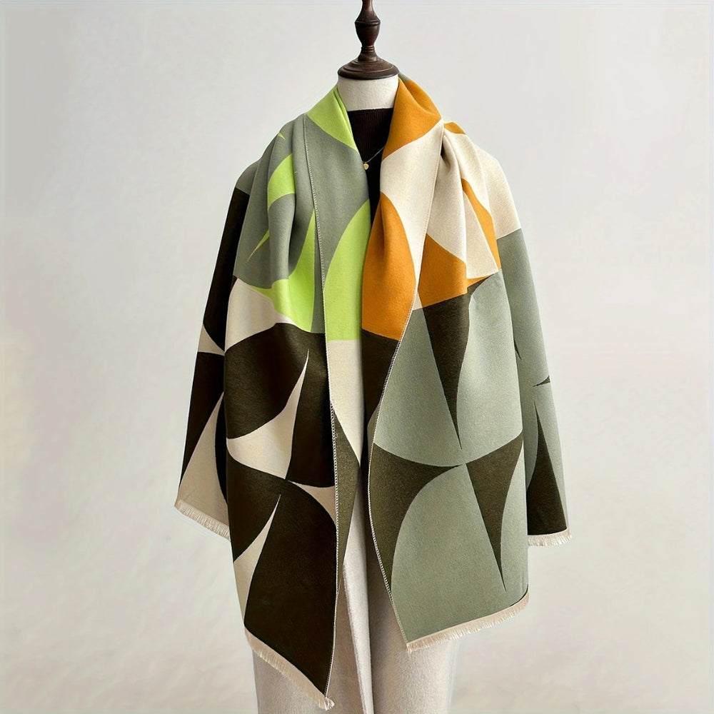 Green and olive Reversible Geometric Poncho Scarf draped on mannequin