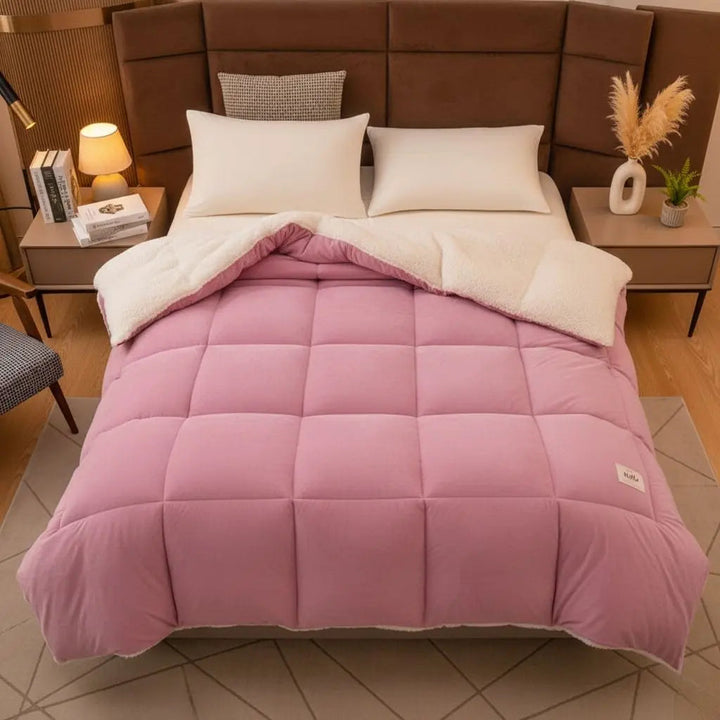 Bean Pink Reversible Velvet Quilted Comforter on bed front view