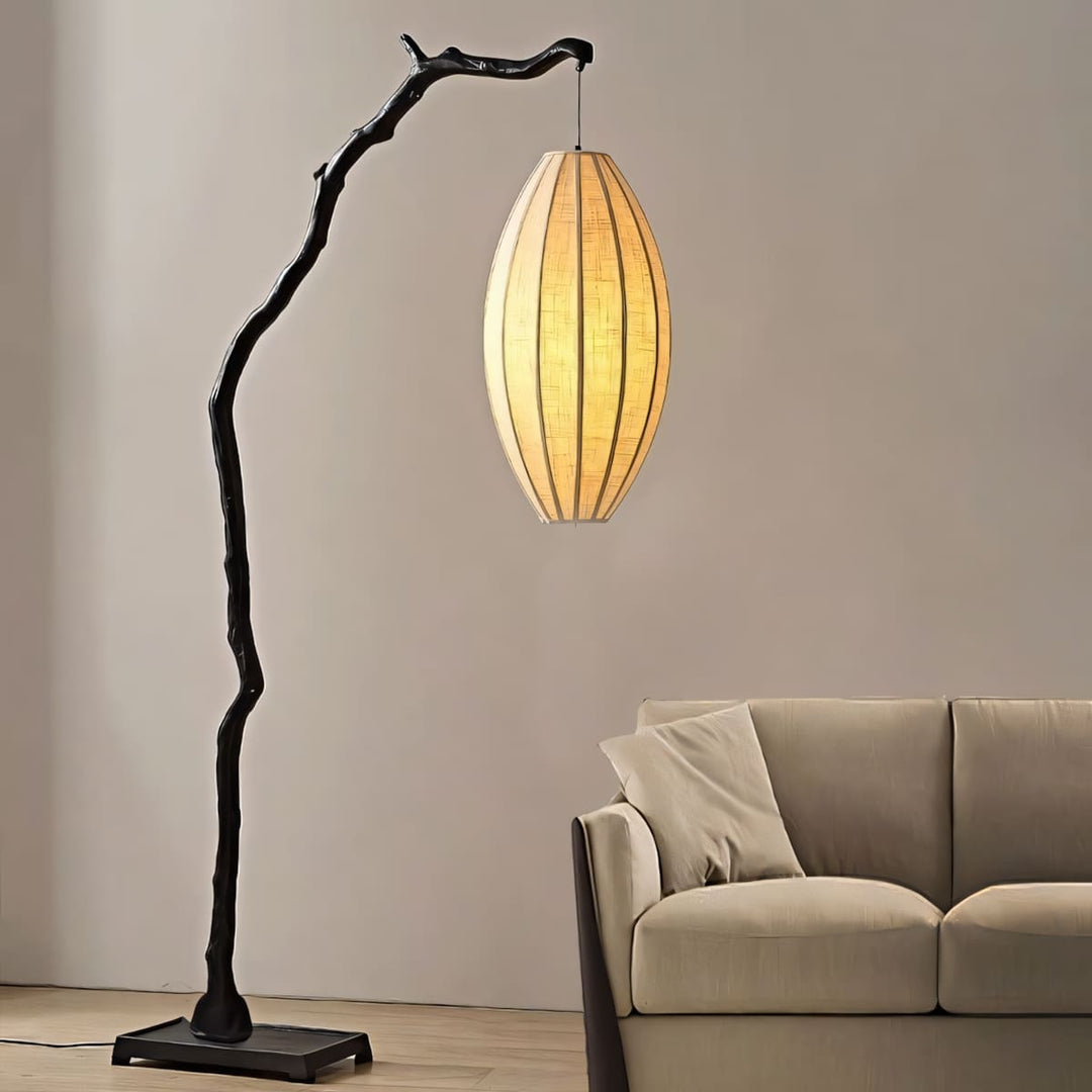 Black Sculptural Branch Floor Lamp beside sofa