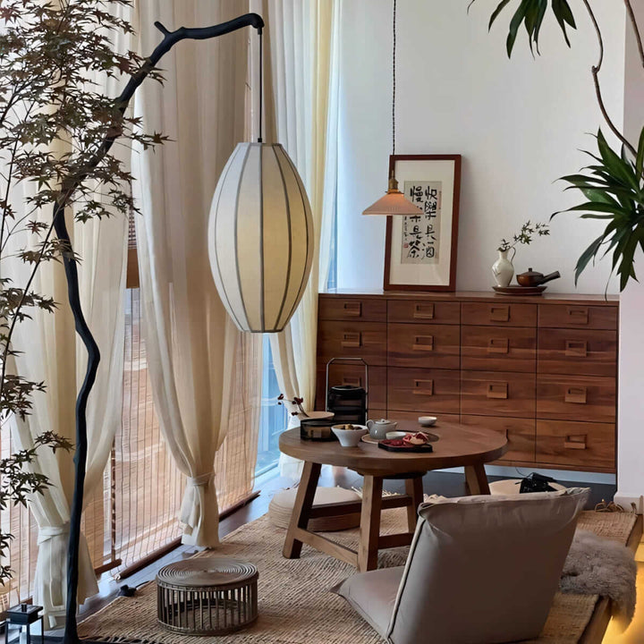 Sculptural Branch Floor Lamp beside wooden dresser
