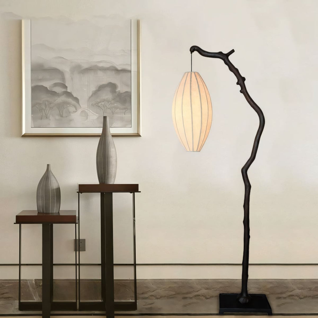 Black Sculptural Branch Floor Lamp beside console and wall art