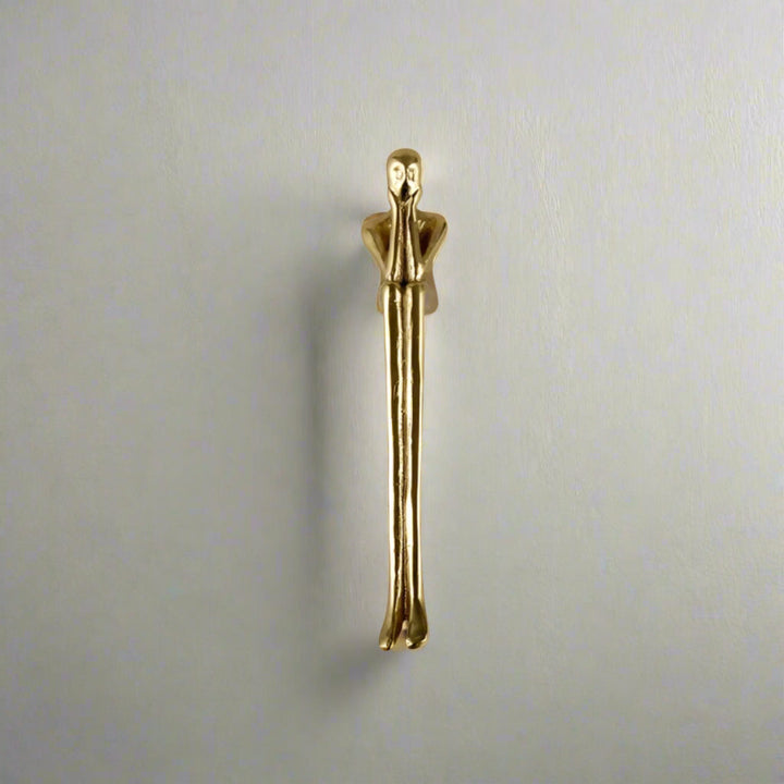 Gold Sculptural Figure Brass Cabinet Pull on white cabinet