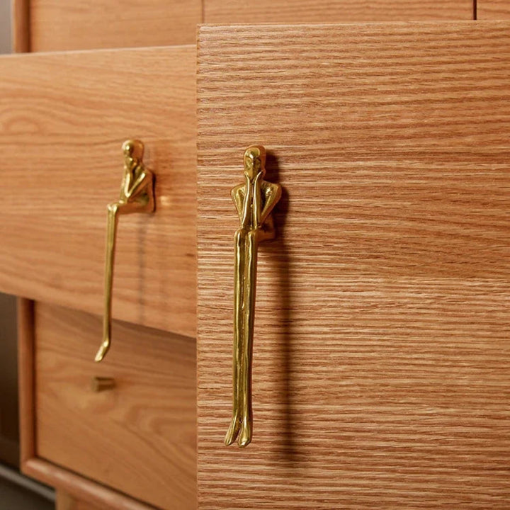 Gold Sculptural Figure Brass Cabinet Pull on wood drawer and door