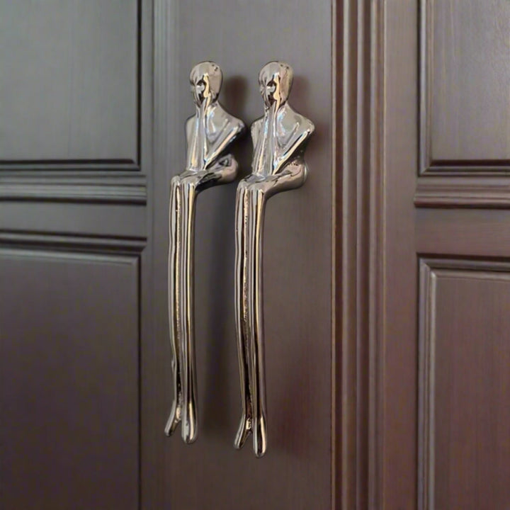 Silver Sculptural Figure Brass Cabinet Pulls on dark doors