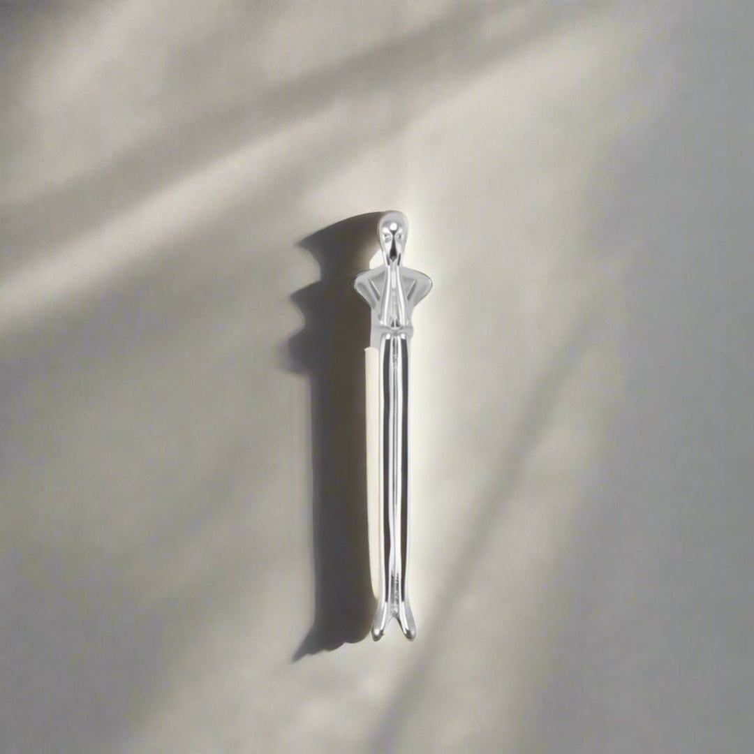 Silver Sculptural Figure Brass Cabinet Pull on white cabinet