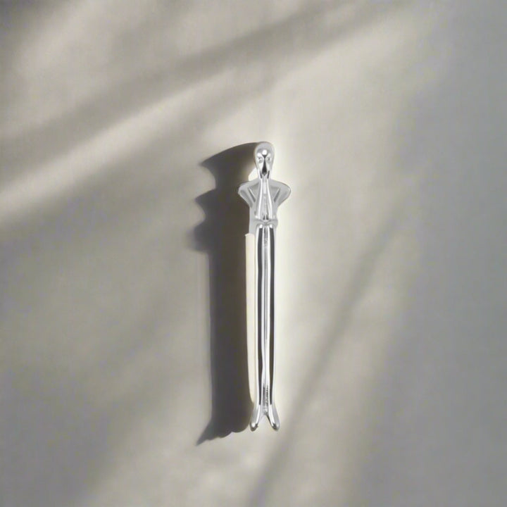 Silver Sculptural Figure Brass Cabinet Pull on white cabinet