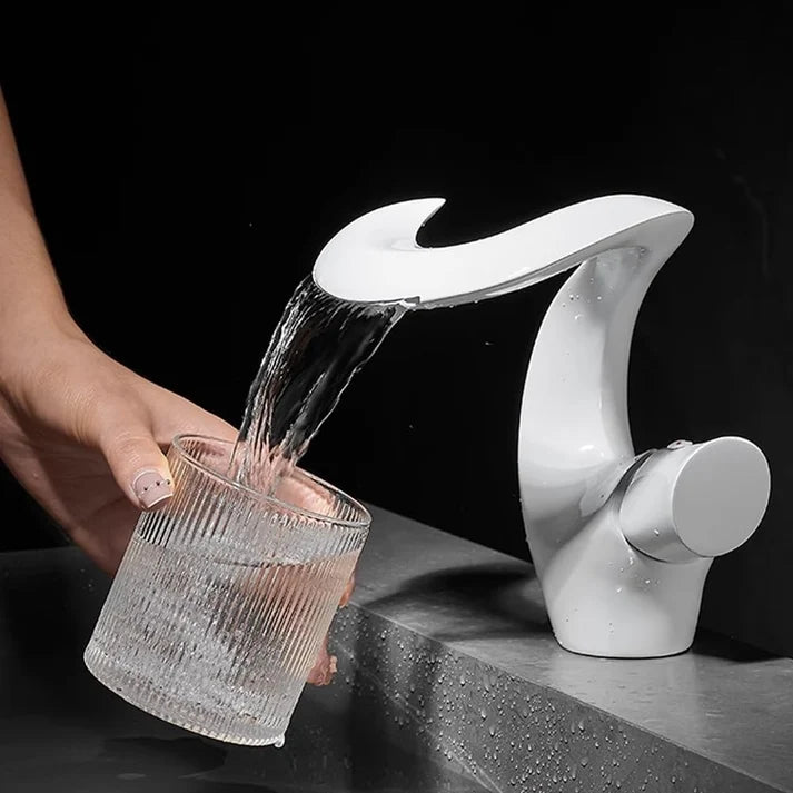 Sleek Modern Waterfall Bathroom Faucet installed on vanity lifestyle