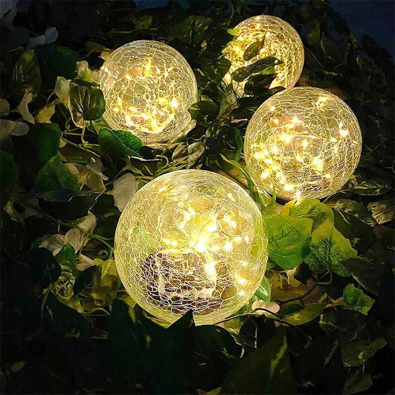 Solar Powered Crackle Glass Garden Globe in garden bed