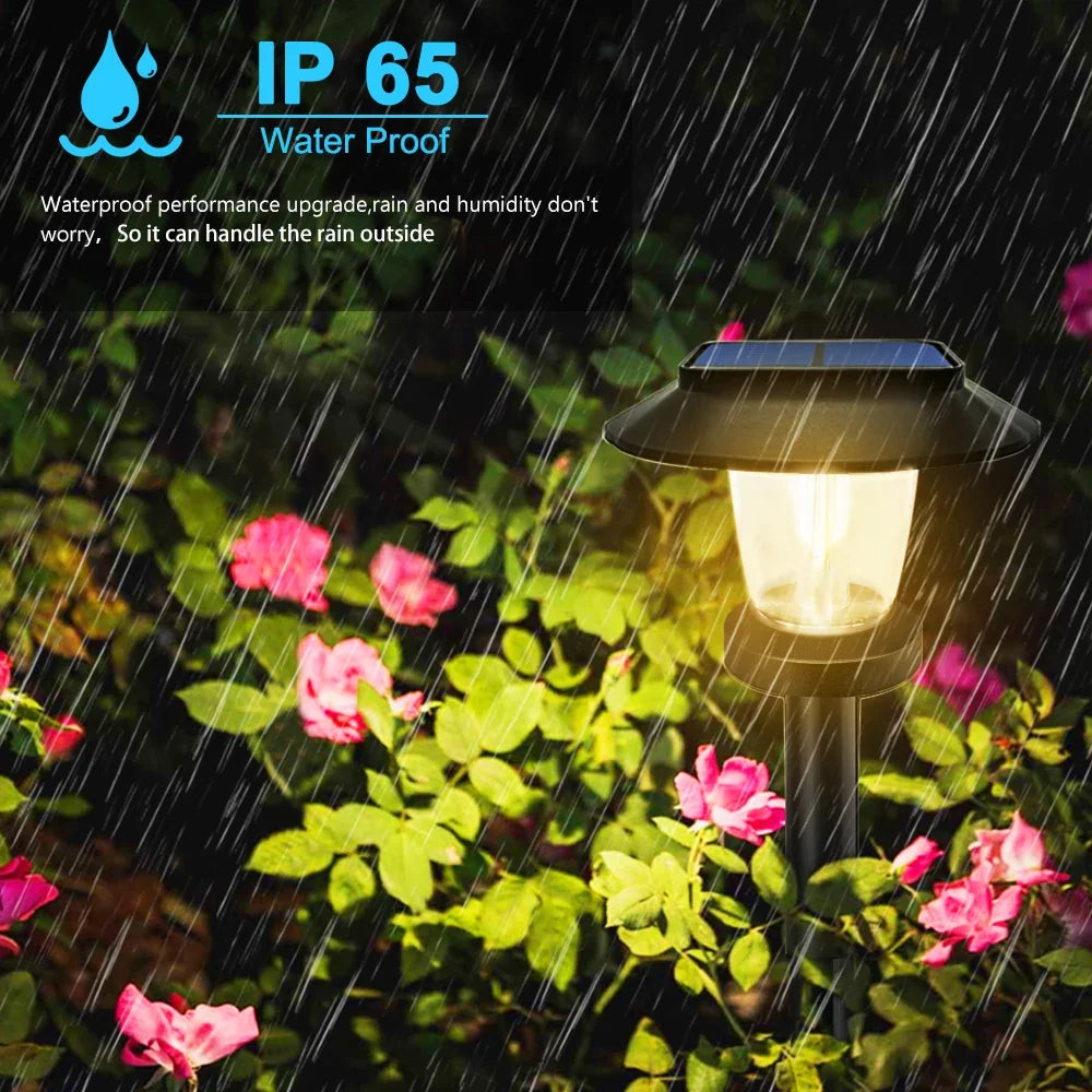 Solar Lantern-Glow Path Stake lit among flowers in rain