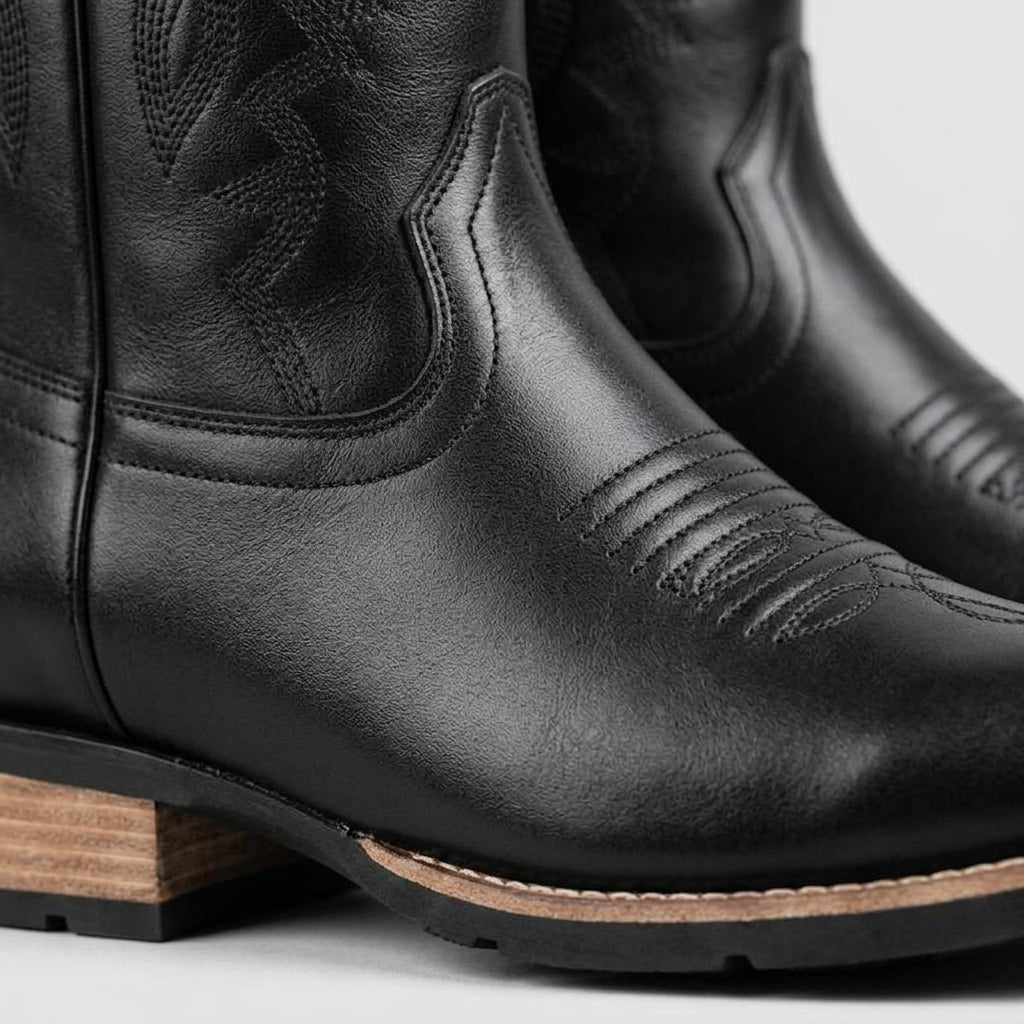 Black square-toe Western boot shaft stitching and heel detail