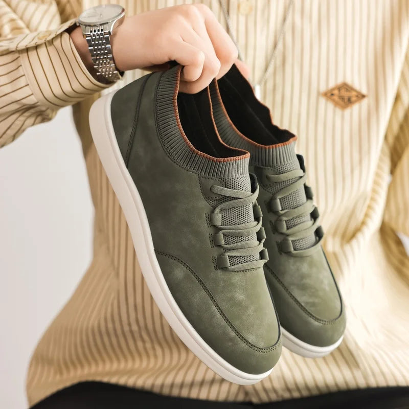 Green Suede Low-Top Sneakers held in hand