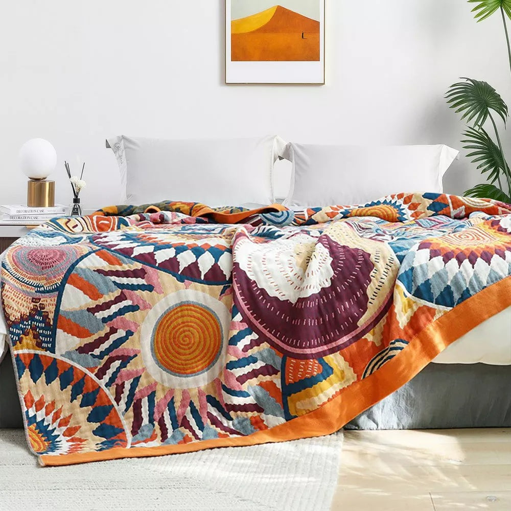 Sunburst Medallion Cotton Throw styled in a bedroom