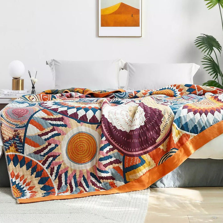 Sunburst Medallion Cotton Throw styled in a bedroom