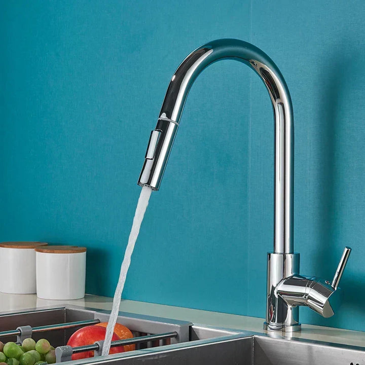 Chrome Pull-Down Kitchen Faucet in use at sink