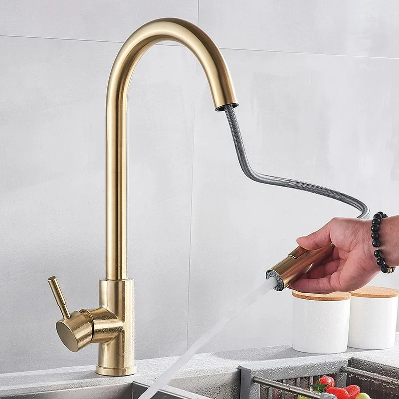 Brushed Gold Pull-Down Kitchen Faucet pull-down sprayer in use